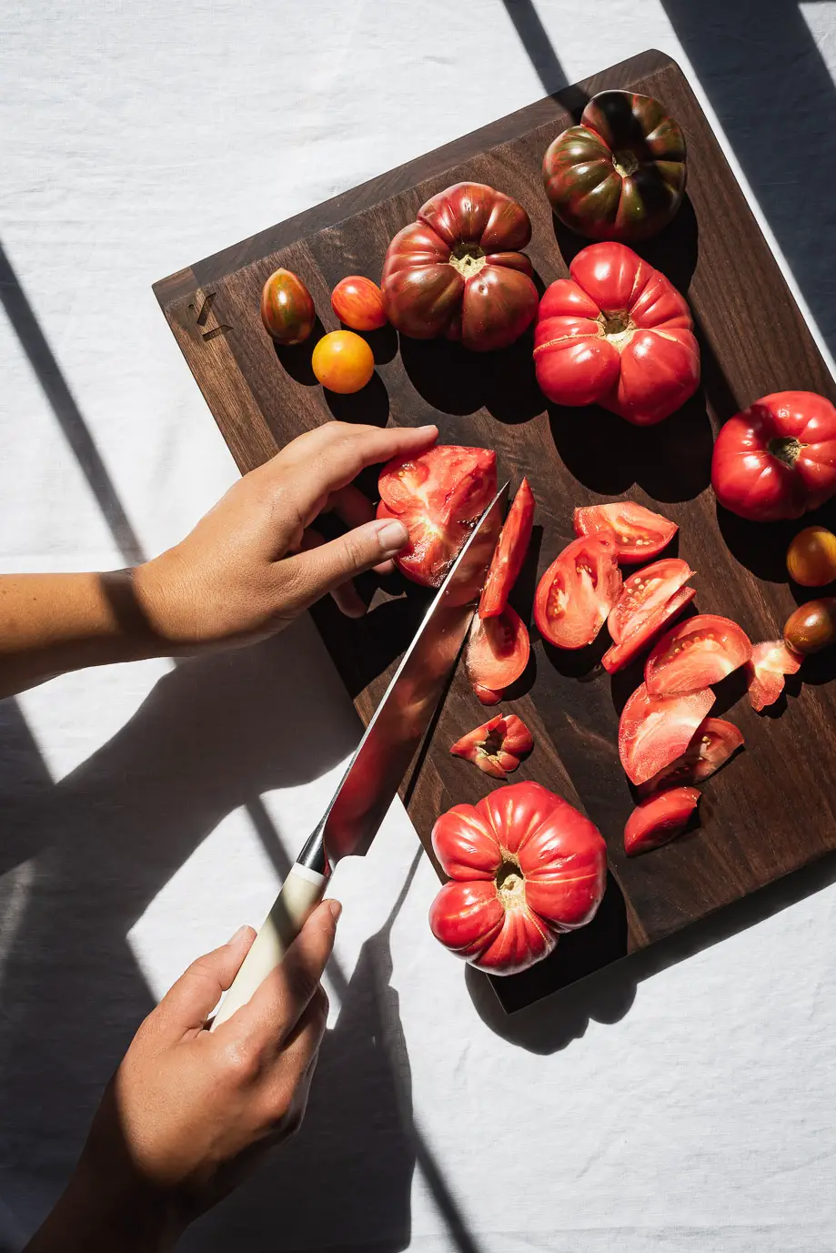 heirloom tomatoes on Material Kitchen angled board