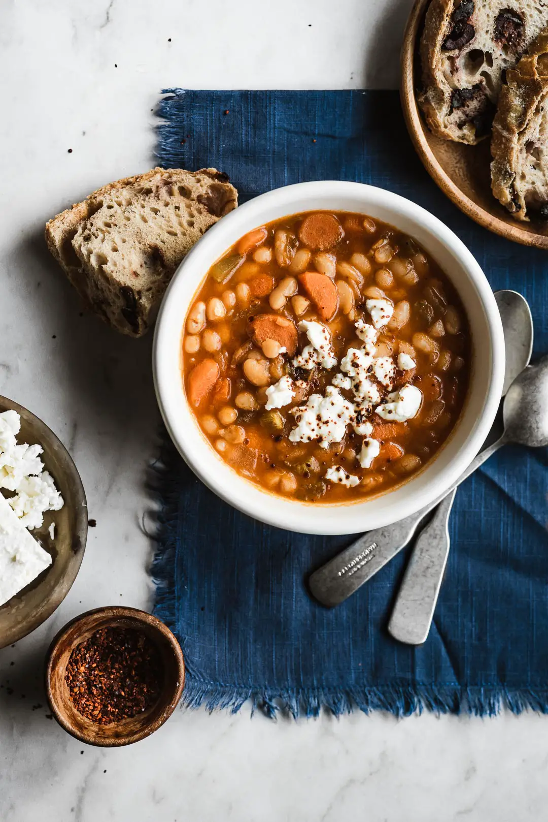 One of the most beloved Greek recipes, Fasolada - Greek White Bean Soup is a simple, nourishing comfort food that pairs beautifully with a bit of crumbled feta, olives, and crusty bread. 