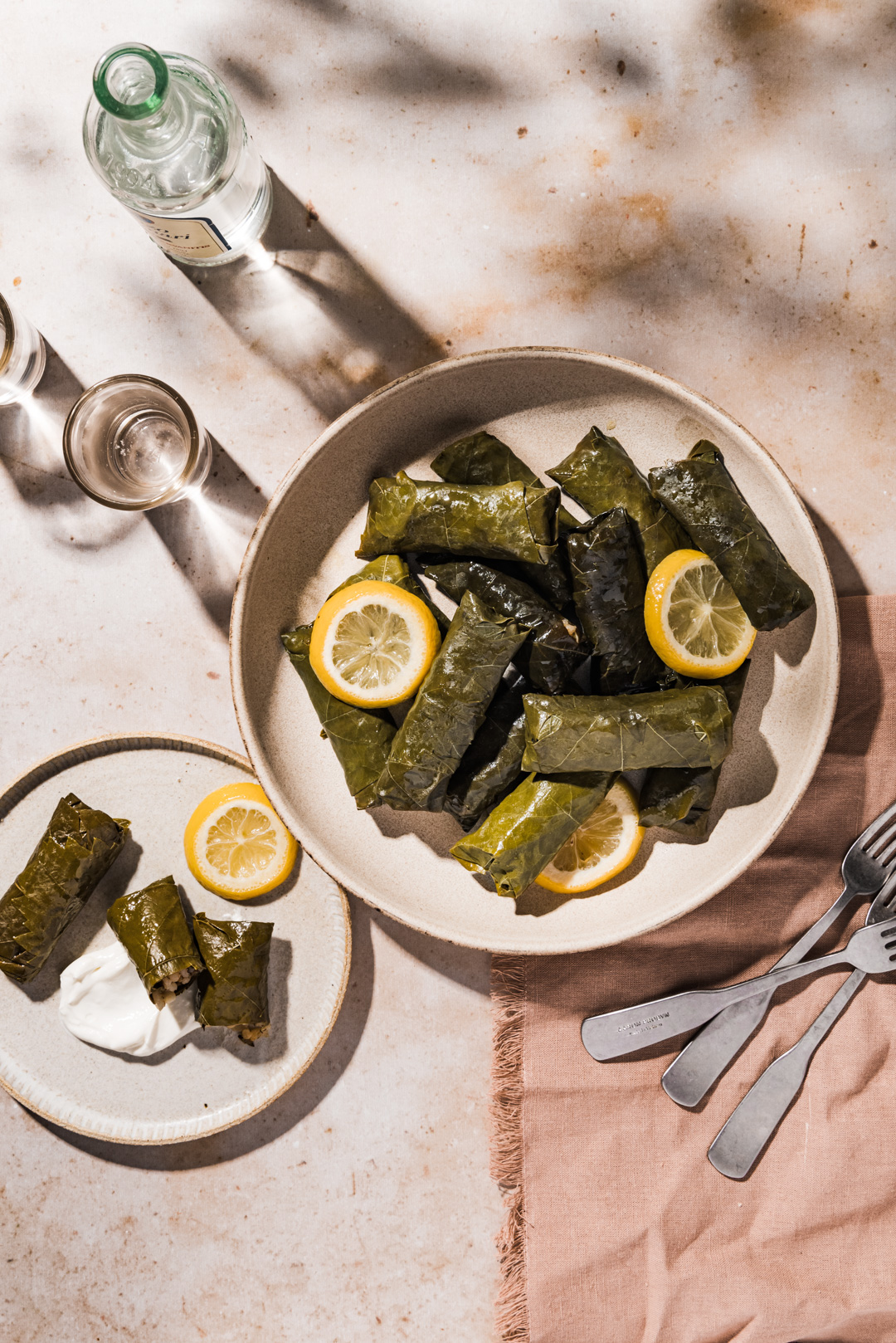 A favorite dish in Greece, these dolmades gialantzi - stuffed grape leaves are flavored with fresh herbs, onion, lemon, tomato & pine nuts.