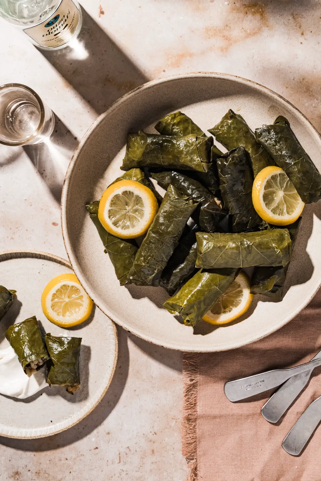 A favorite dish in Greece, these dolmades gialantzi - stuffed grape leaves are flavored with fresh herbs, onion, lemon, tomato & pine nuts.