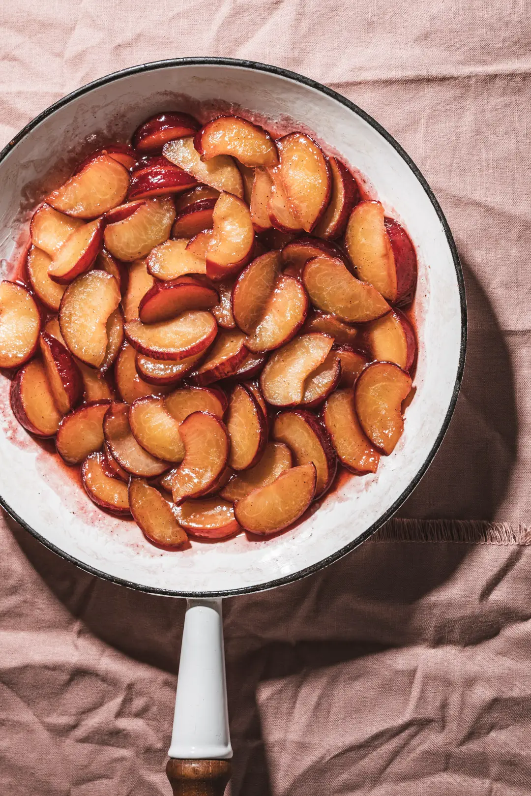 Sautéeing plums in a bit of butter, honey & vanilla is the simplest way to transform them. They become luscious, ruby tinged jewels ready to adorn your everyday eats. Enjoy them atop a simple bowl of yogurt, ice cream, oatmeal or pancakes. These simple sautéed plums will make you reconsider simply eating a plum out of hand.
