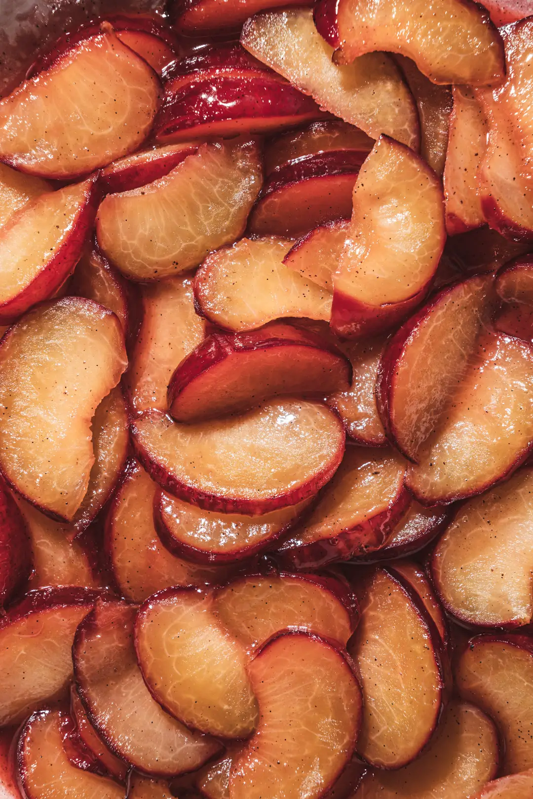 Sautéeing plums in a bit of butter, honey & vanilla is the simplest way to transform them. They become luscious, ruby tinged jewels ready to adorn your everyday eats. Enjoy them atop a simple bowl of yogurt, ice cream, oatmeal or pancakes. These simple sautéed plums will make you reconsider simply eating a plum out of hand.