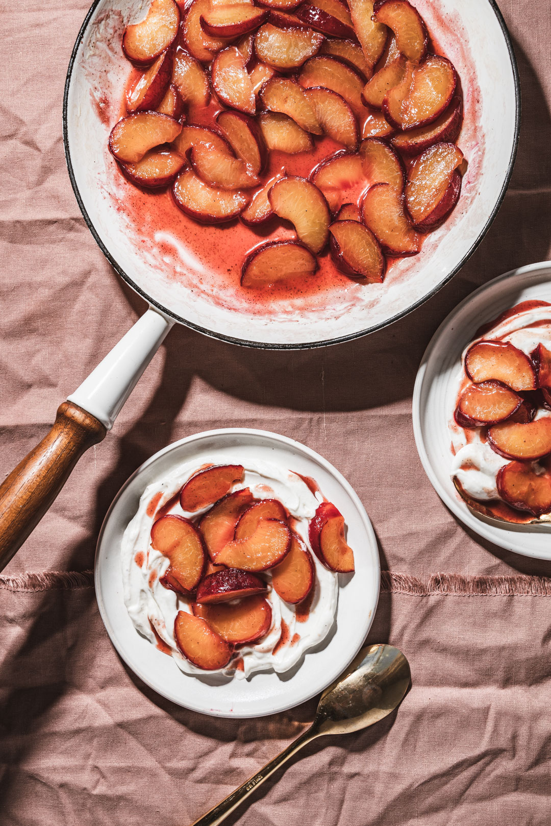 Sautéeing plums in a bit of butter, honey & vanilla is the simplest way to transform them. They become luscious, ruby tinged jewels ready to adorn your everyday eats. Enjoy them atop a simple bowl of yogurt, ice cream, oatmeal or pancakes. These simple sautéed plums will make you reconsider simply eating a plum out of hand.