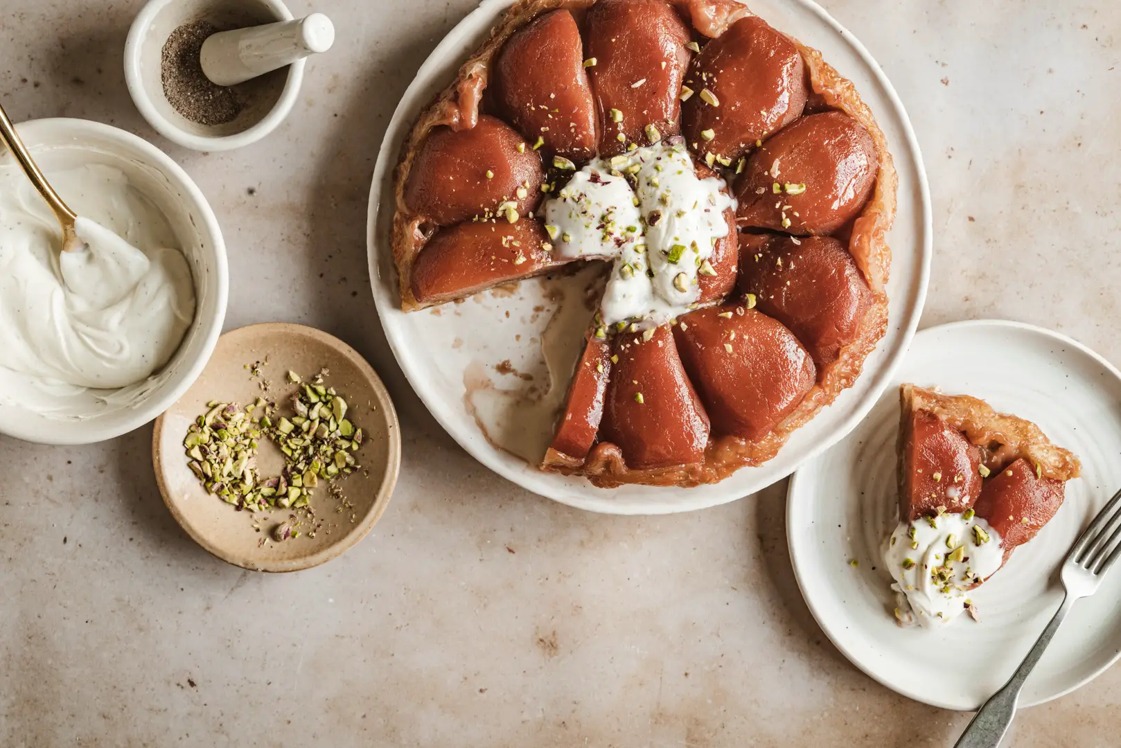 This quince tarte tatin topped with cardamom crème fraîche & pistachios is the ultimate way to display the glory of this ancient fruit