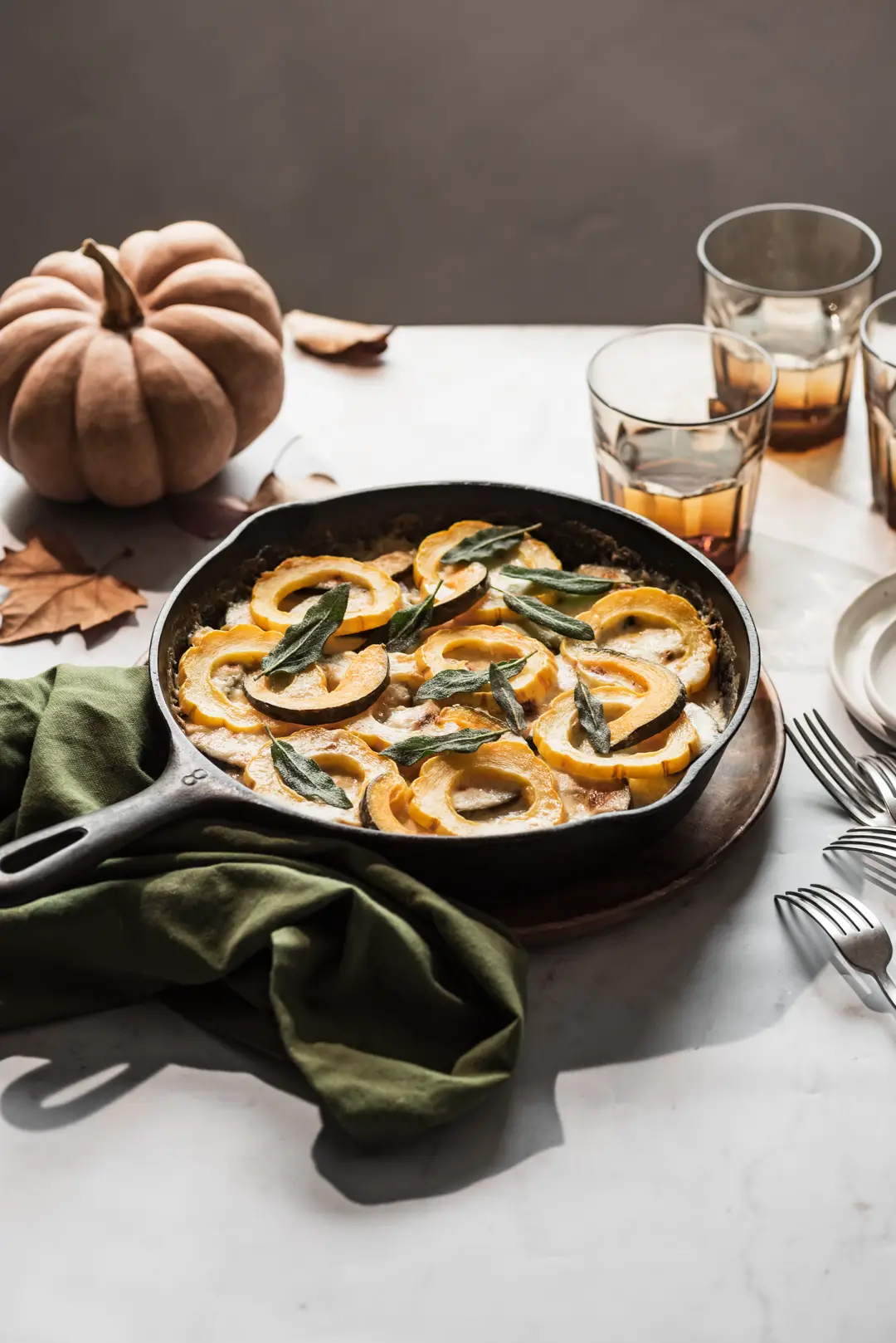 This creamy, cheesy winter squash au gratin topped with crispy sage leaves is a delicious vegetarian main course or side dish to a roast.
