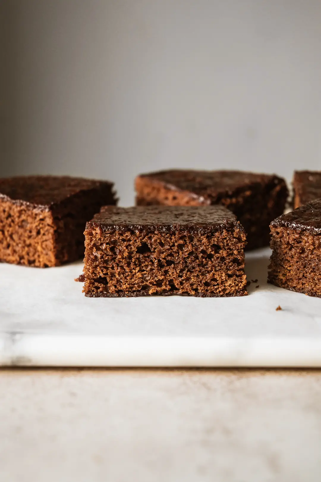 This sticky gingerbread spice cake features warm flavors with a sticky exterior that yields to a tender crumb