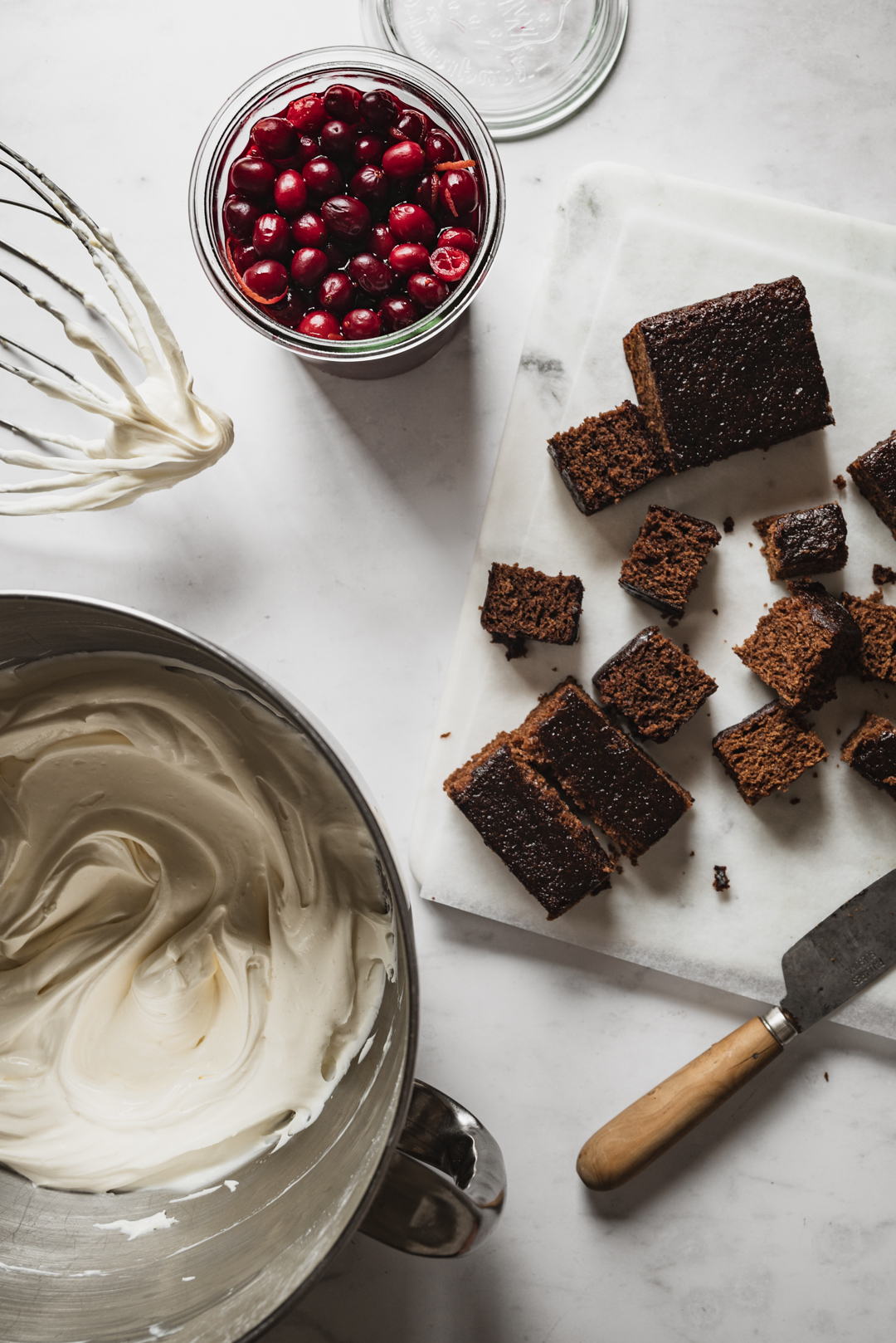 This festive trifle features sticky gingerbread spice cake, luscious whipped cheesecake & soft candied cranberries.